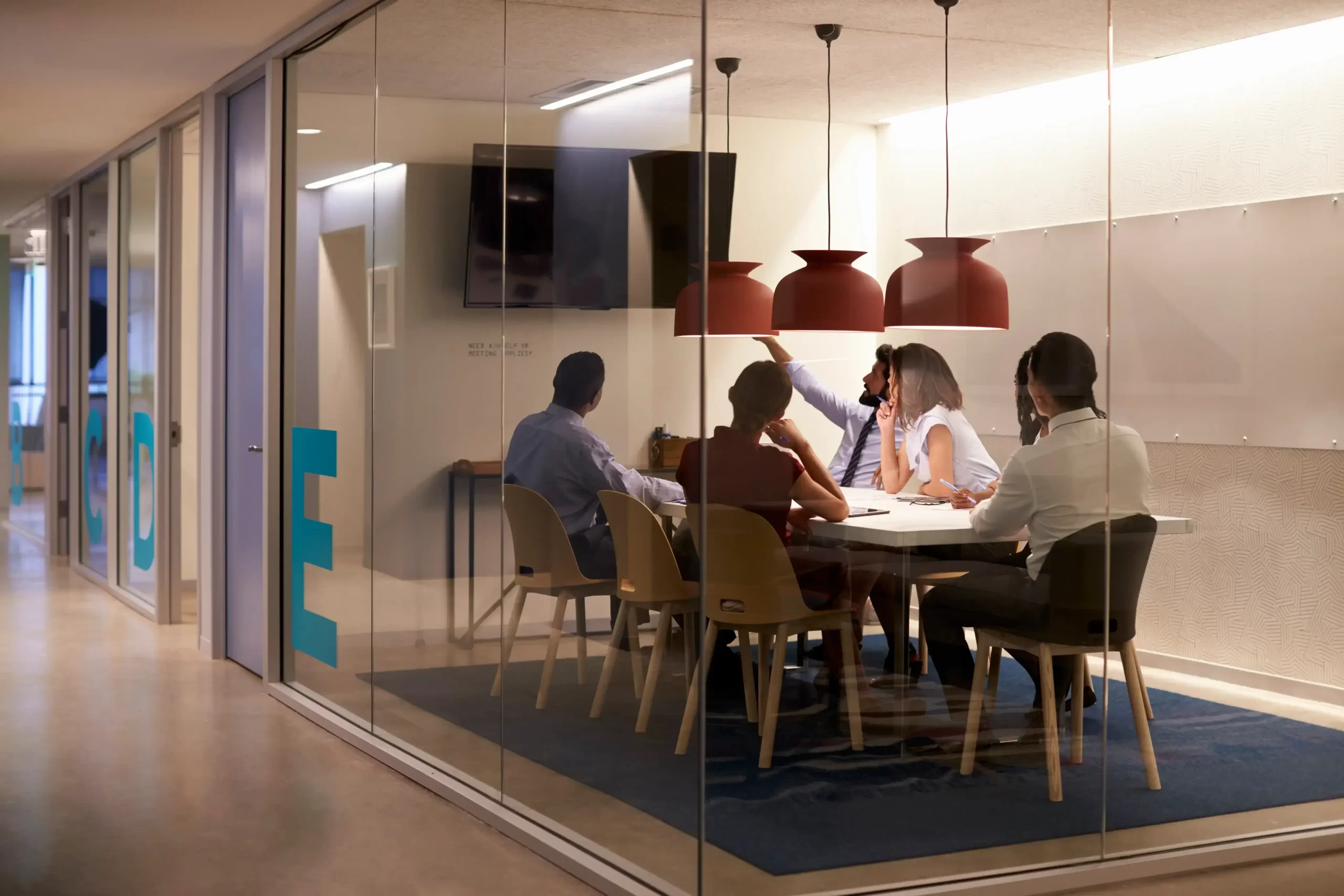 corporate-business-team-using-av-display-meeting-cubicle[1]