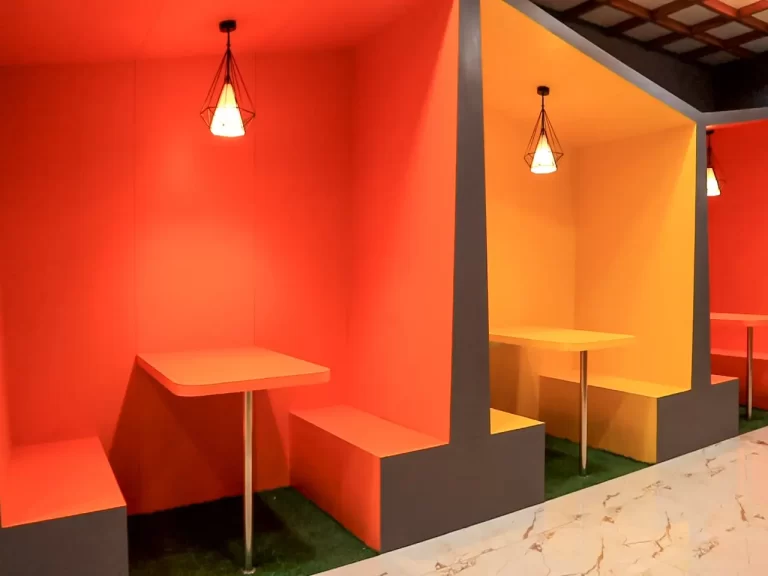 Vibrant corridor seating area with colorful chairs